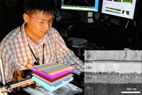 Postdoctoral researcher Young-Shin Park characterizing emission spectra of LEDs in the Los Alamos National Laboratory optical laboratory. Inset: The quantum dot device structure shown with a transmission electron microscopy (TEM) image of a cross-section of a real device