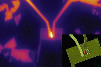 In the team's experimental setup, electricity was supplied to a tiny piece of tungsten selenide (small rectangle at center) through two gold wires (from top left and right), causing it to emit light (bright area at center), demonstrating its potential as an LED material. Inset: Microscope image shows the teams experimental setup. (Images courtesy of Britt Baugher and Hugh Churchill)